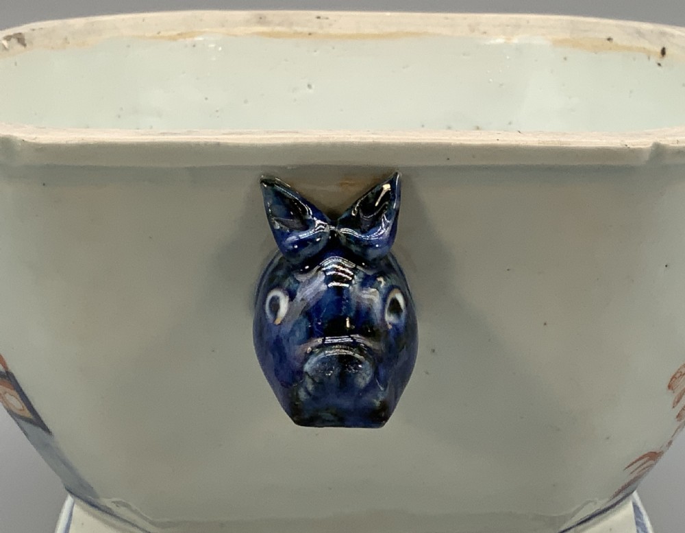 An 18th-century Chinese export porcelain jardiniere decorated with hand-painted floral motifs in cobalt blue and iron-red with blue side handles. View VI