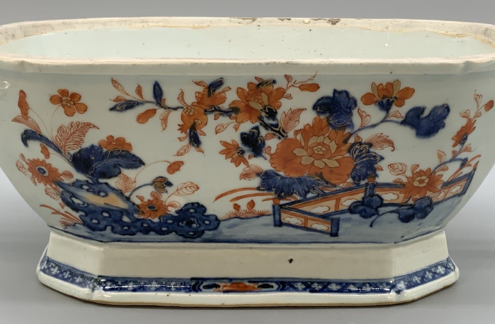 An 18th-century Chinese export porcelain jardiniere decorated with hand-painted floral motifs in cobalt blue and iron-red with blue side handles. View VII