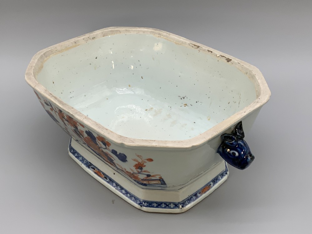 An 18th-century Chinese export porcelain jardiniere decorated with hand-painted floral motifs in cobalt blue and iron-red with blue side handles. View X
