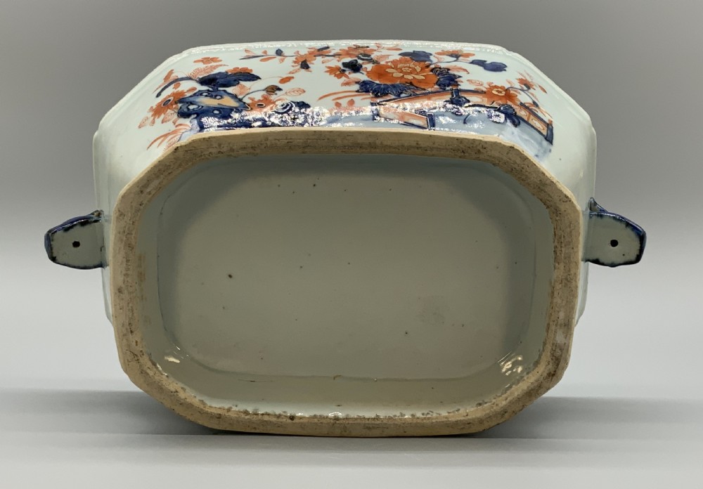 An 18th-century Chinese export porcelain jardiniere decorated with hand-painted floral motifs in cobalt blue and iron-red with blue side handles. View XI