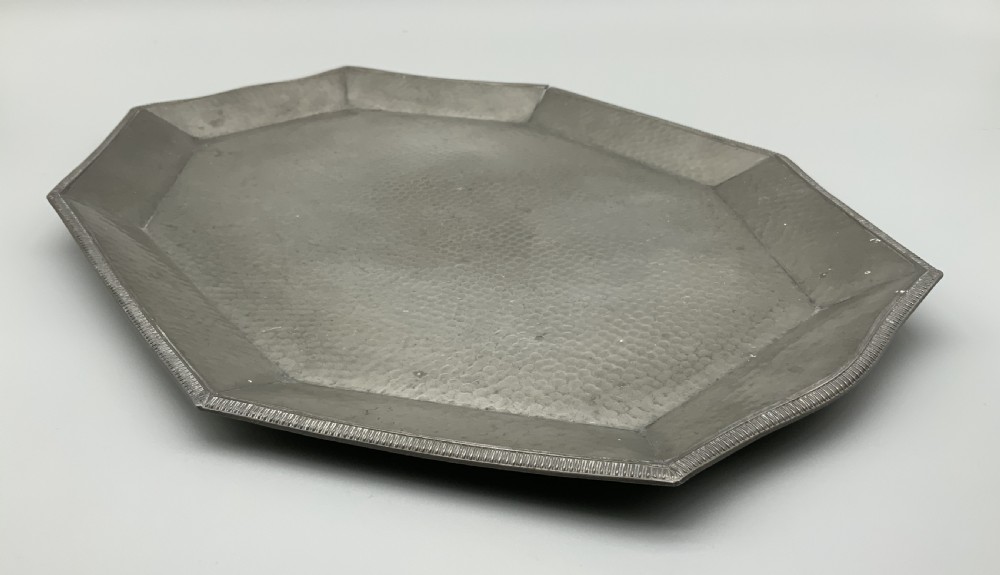 A five-piece Art Deco pewter tea and coffee set featuring a planished finish, geometric handles, and an octagonal tray. View XIII