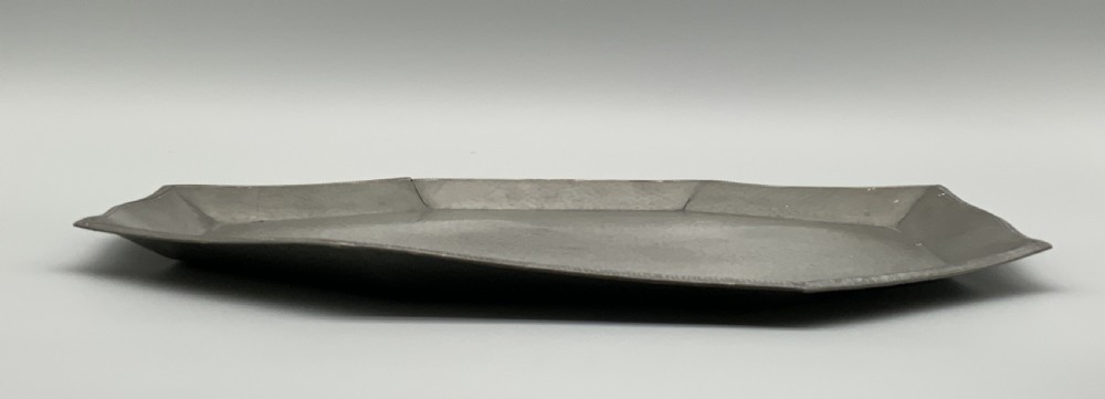A five-piece Art Deco pewter tea and coffee set featuring a planished finish, geometric handles, and an octagonal tray. View XIV