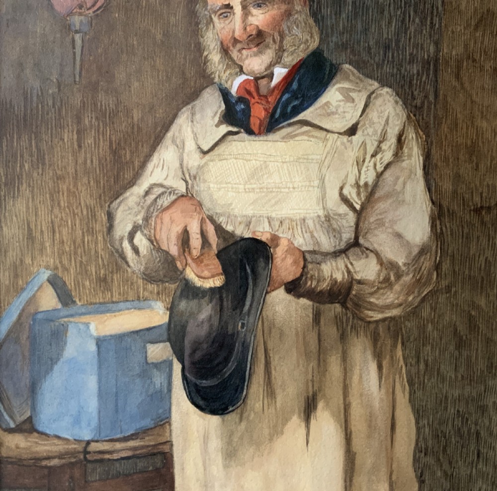 An antique watercolour painting depicting an elderly man in a smock brushing a black bowler hat, mounted inside an ornate gold gilt frame. View VIII