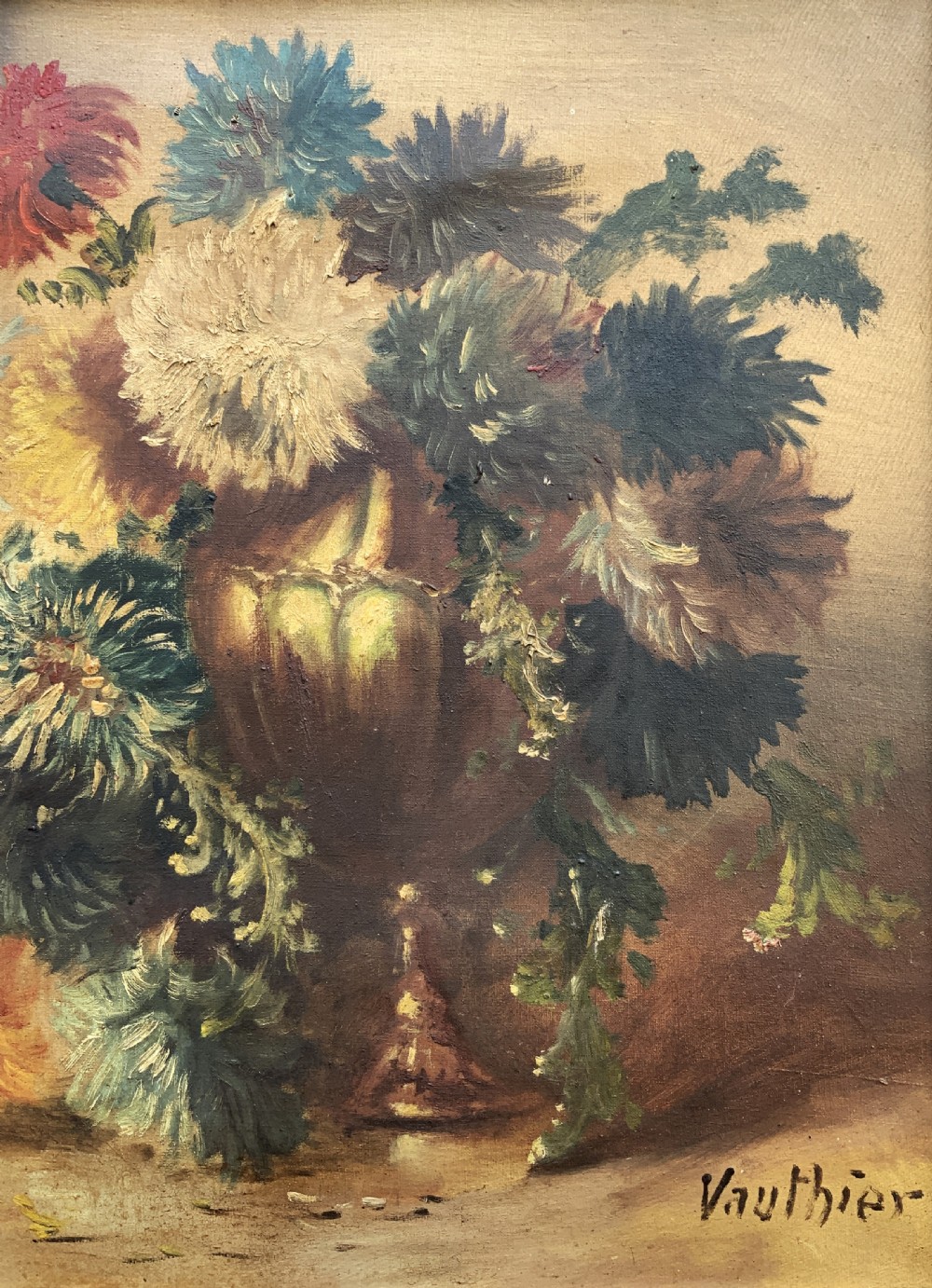 A 19th-century floral oil painting on canvas depicting a dense bouquet of colourful flowers in a vase, enclosed within an ornate, deeply carved gold frame. View V