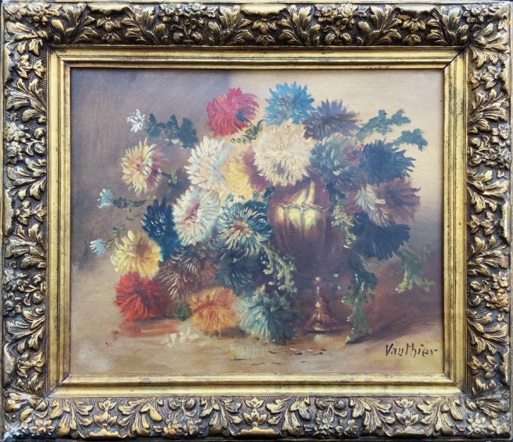 A 19th-century floral oil painting on canvas depicting a dense bouquet of colourful flowers in a vase, enclosed within an ornate, deeply carved gold frame. View X