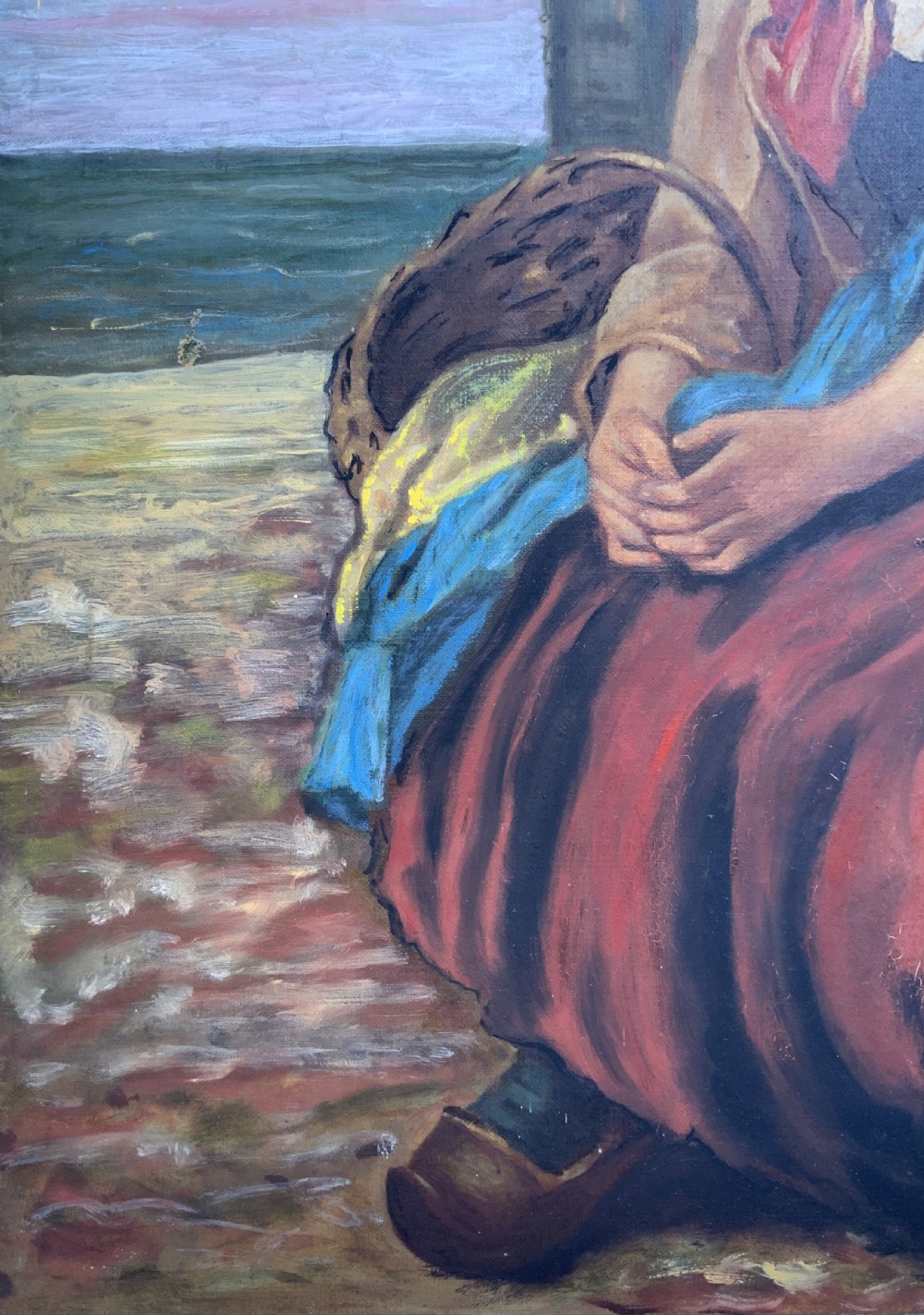 A 19th-century oil painting depicting a young Dutch fisher girl in traditional costume seated near the sea, housed within an ornate gilt wooden frame. View XI