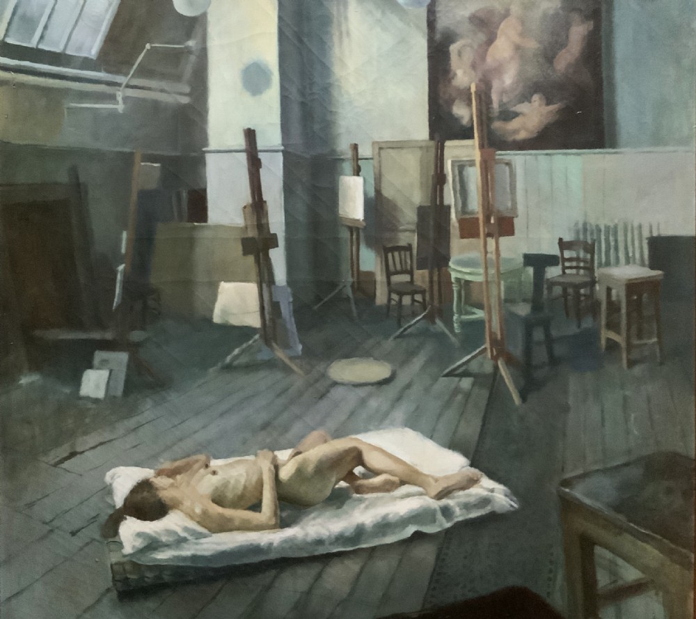 A large framed oil painting depicting an artist studio with a ceiling skylight, wooden easels, and a reclining nude figure on a floor mattress. View III