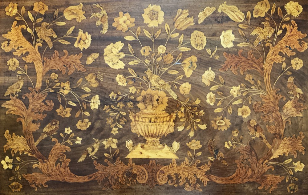 An 18th-century Dutch walnut tea table featuring floral fruitwood marquetry inlays, a tray top, brass handles, and cabriole legs. View VII