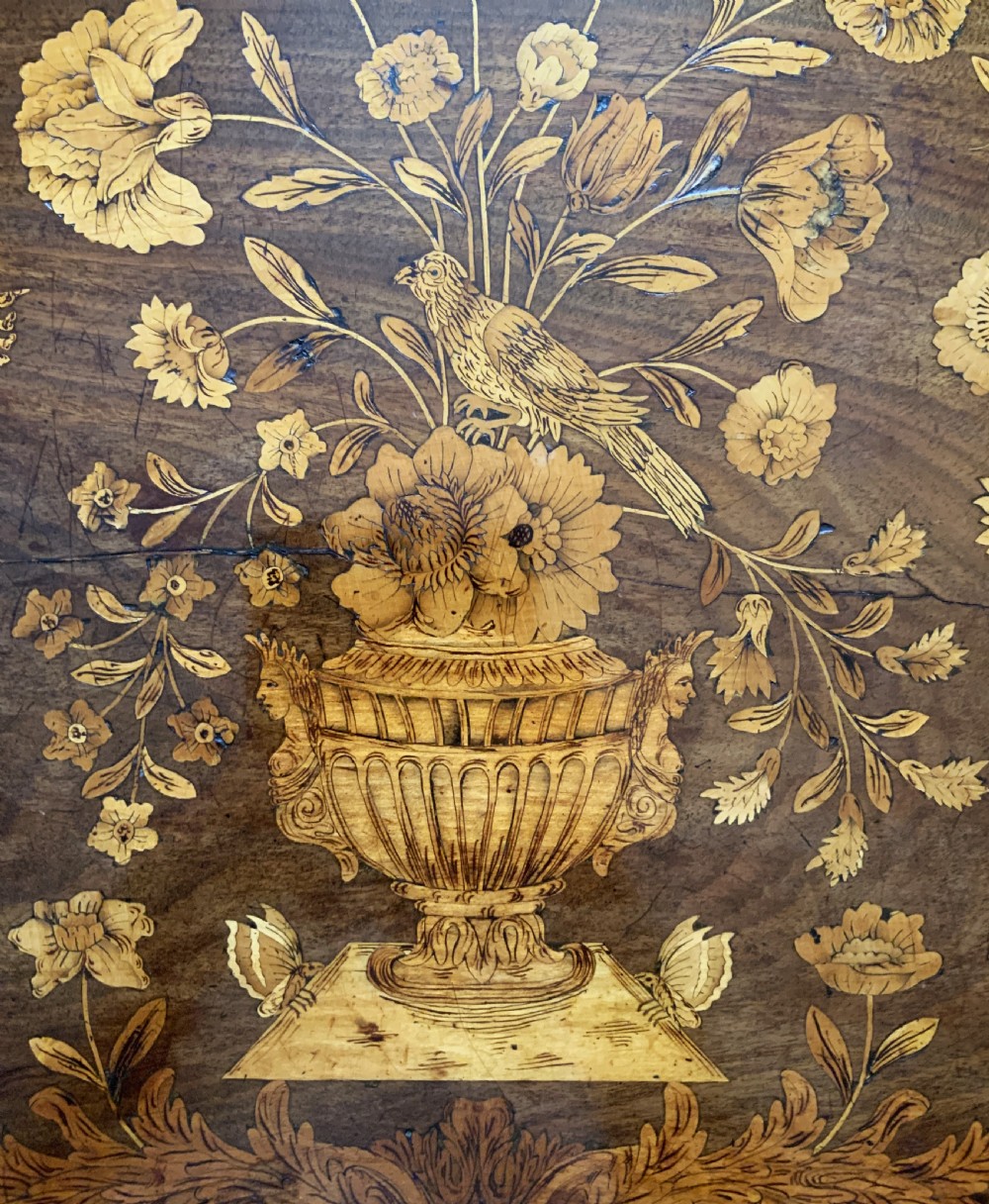 An 18th-century Dutch walnut tea table featuring floral fruitwood marquetry inlays, a tray top, brass handles, and cabriole legs. View IX