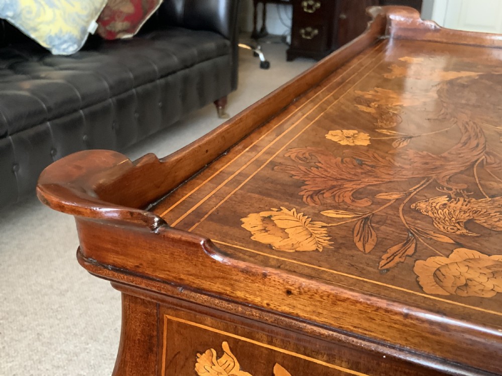 An 18th-century Dutch walnut tea table featuring floral fruitwood marquetry inlays, a tray top, brass handles, and cabriole legs. View XI