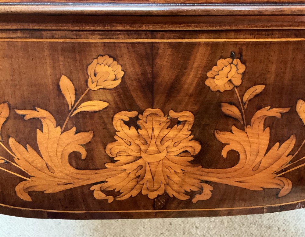 An 18th-century Dutch walnut tea table featuring floral fruitwood marquetry inlays, a tray top, brass handles, and cabriole legs. View XII