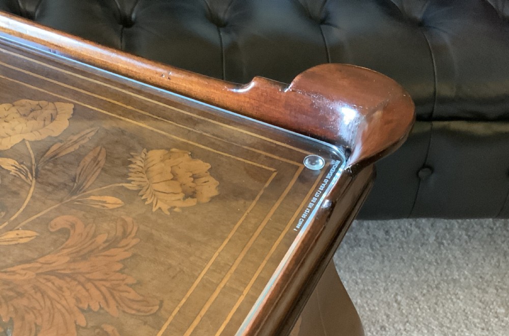 An 18th-century Dutch walnut tea table featuring floral fruitwood marquetry inlays, a tray top, brass handles, and cabriole legs. View XXIII