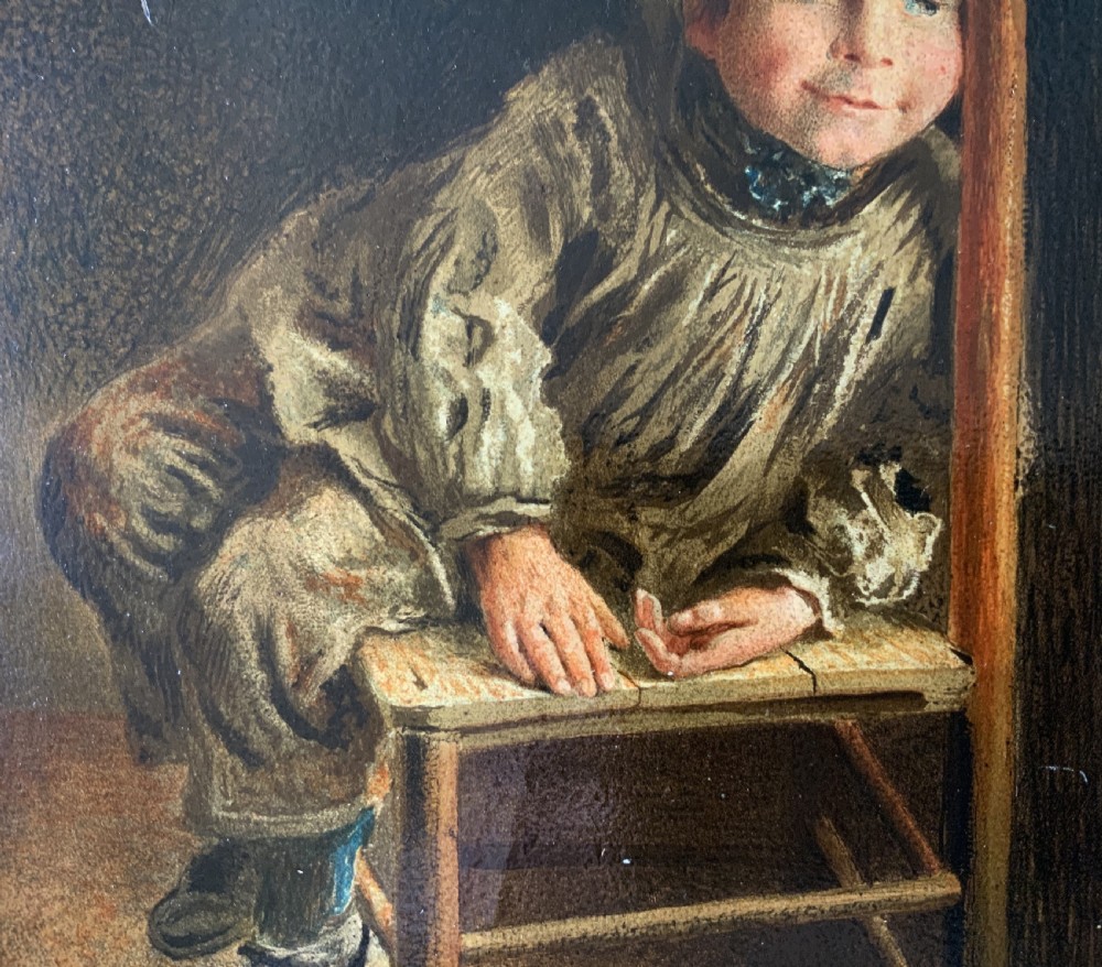 A nineteenth-century Victorian oleograph portrait of a young child sitting on a wooden chair, presented in an ornate gold leaf frame. View V