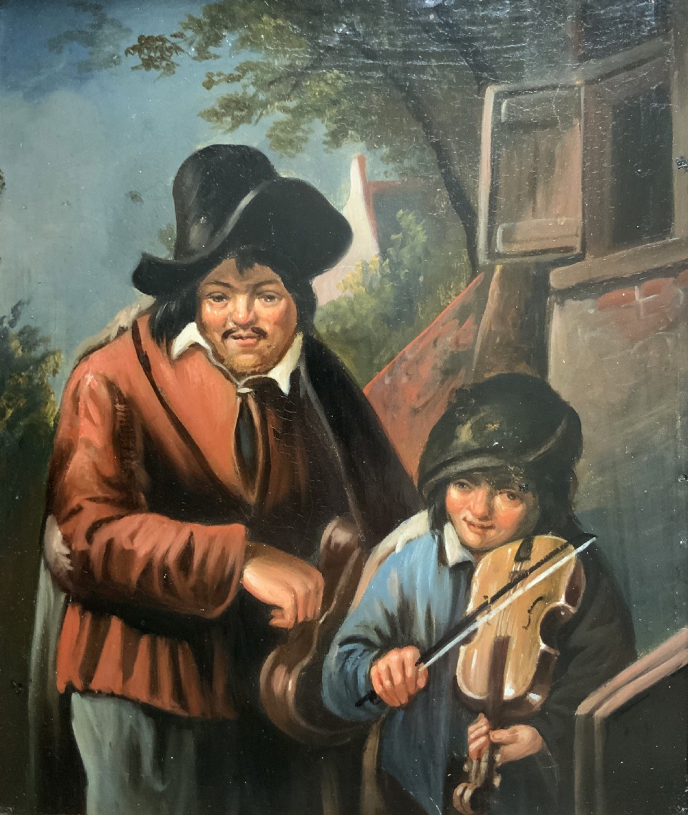 An antique oil painting depicting two musicians, a man and a boy playing a violin, set in a wide wooden frame with a gilded inner moulding. View II