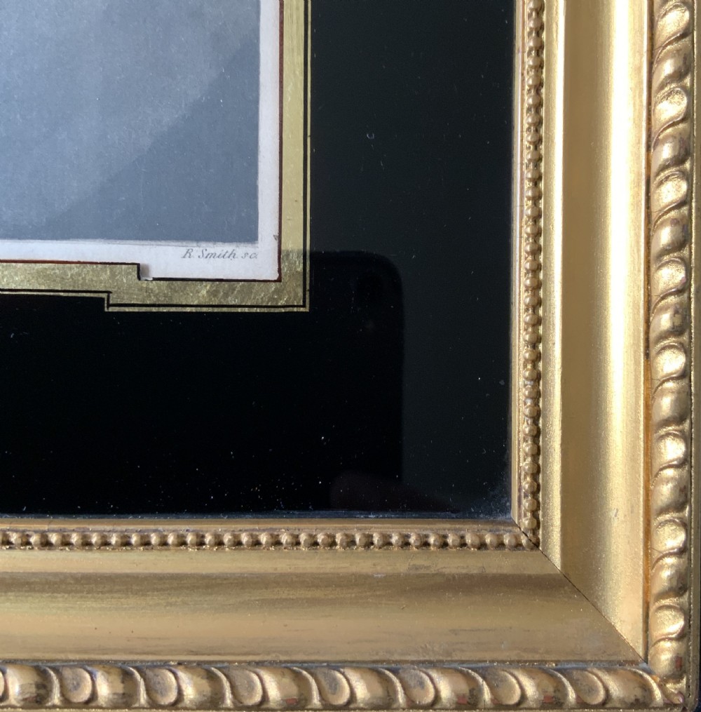 A framed 18th-century hand-coloured portrait engraving of a woman in a bonnet, set within a black glass mount and a beaded gilt frame. View VII