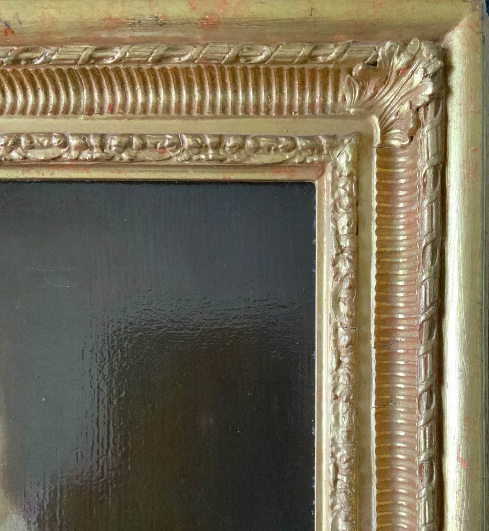 An early nineteenth-century portrait painting of a gentleman wearing a white cravat and dark coat, set within a carved gilt frame. View IX