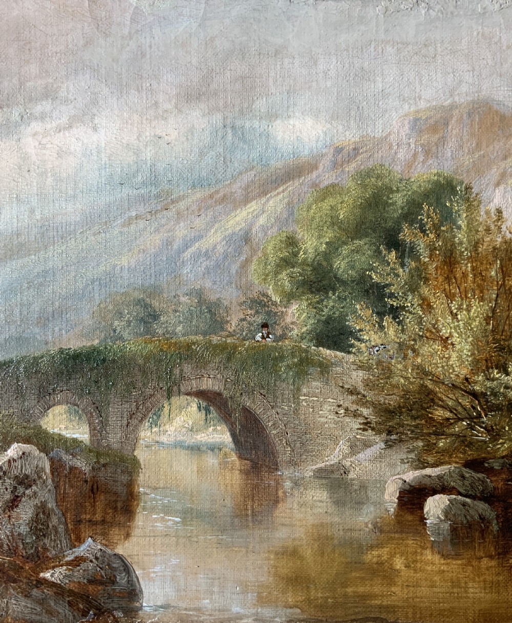A framed 19th-century oil painting depicting an arched stone bridge crossing a river amidst trees and distant mountains. View IV