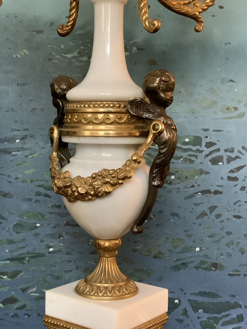 A three-piece antique clock garniture set featuring a central gilt bronze and white marble clock flanked by two matching multi-arm candelabra. View XIII