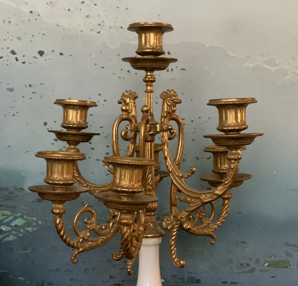 A three-piece antique clock garniture set featuring a central gilt bronze and white marble clock flanked by two matching multi-arm candelabra. View XIV