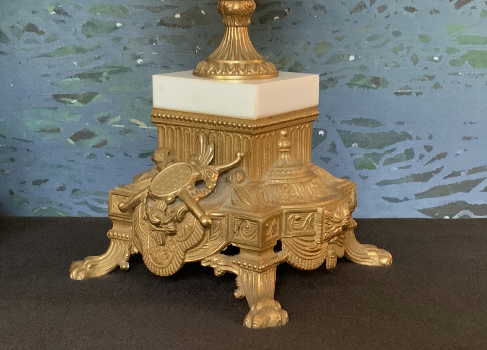 A three-piece antique clock garniture set featuring a central gilt bronze and white marble clock flanked by two matching multi-arm candelabra. View XV
