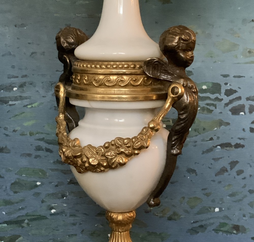 A three-piece antique clock garniture set featuring a central gilt bronze and white marble clock flanked by two matching multi-arm candelabra. View XVI