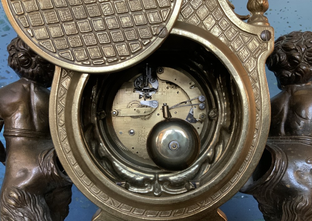 A three-piece antique clock garniture set featuring a central gilt bronze and white marble clock flanked by two matching multi-arm candelabra. View XXII
