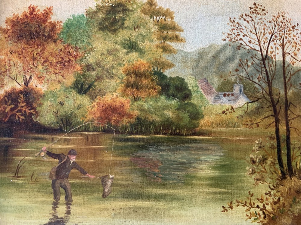 An Edwardian oil painting depicting an angler fly fishing in a river surrounded by trees, enclosed in a moulded gold gilt frame. View IV