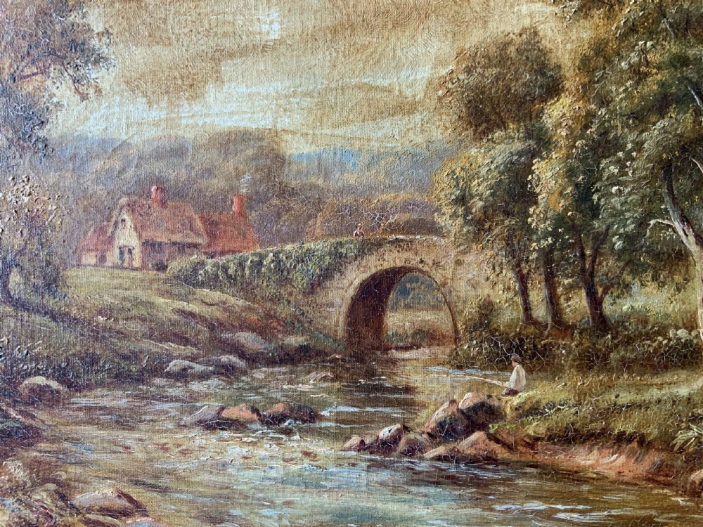An antique oil painting depicting a tranquil river flowing through a wooded landscape with a stone bridge and cottage in the background, framed in polished dark wood. View VIII