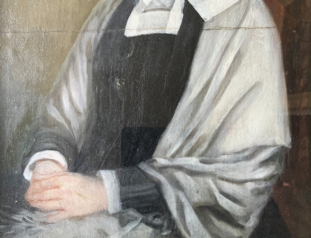 A nineteenth-century oil portrait painting depicting a seated lady wearing a white lace bonnet and grey shawl, housed in a black ebonised frame with a pale inner slip. View VII