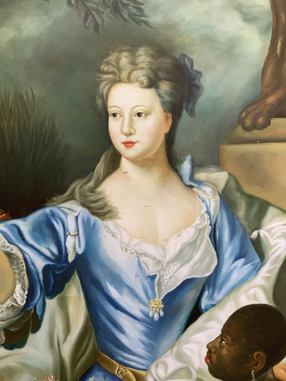 A Georgian-style oil painting on canvas depicting a noblewoman in a blue gown holding flowers alongside an attendant, housed in a moulded wood frame. View X