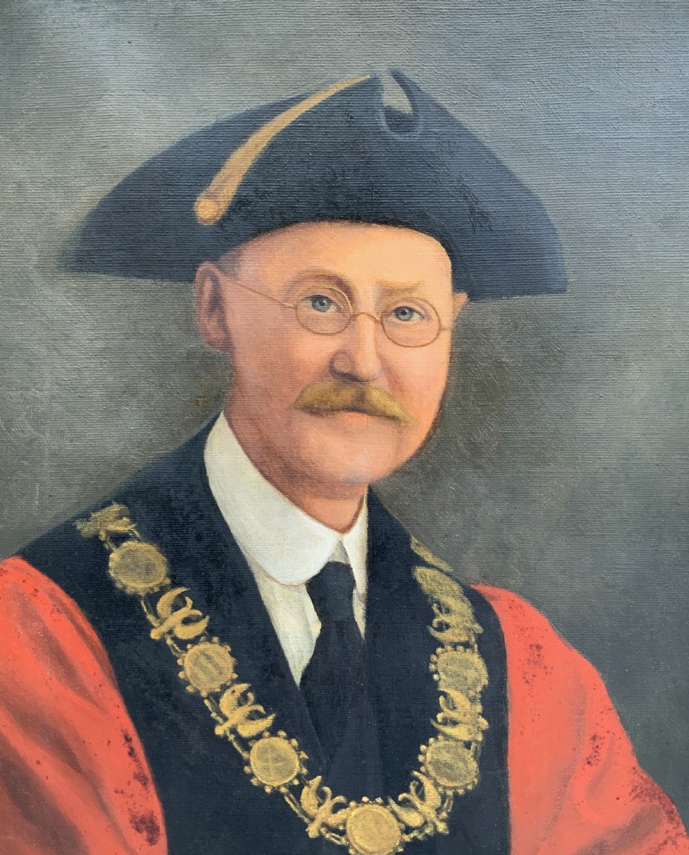 An oil portrait of a bespectacled man with a moustache wearing a tricorne hat, dark tie, red ceremonial robes, and a gold mayors chain of office, presented in a gilded wood frame. View VIII