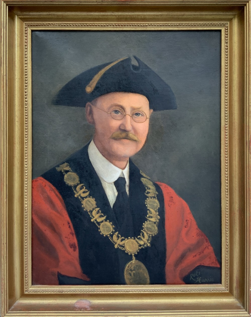 An oil portrait of a bespectacled man with a moustache wearing a tricorne hat, dark tie, red ceremonial robes, and a gold mayors chain of office, presented in a gilded wood frame. View XIII