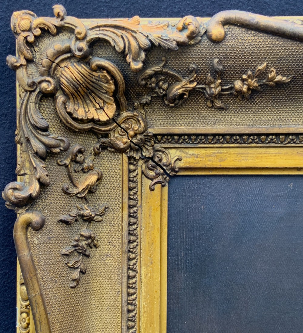 An 18th-century oil portrait of a clergyman in a powdered wig and clerical bands, framed in a carved giltwood frame. View XI