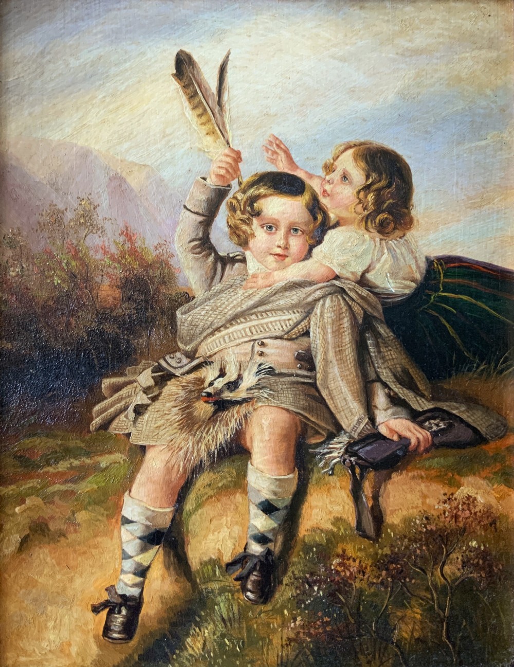 A 19th-century framed oil painting depicting two young children in traditional Scottish Highland dress set within a molded timber frame. View III