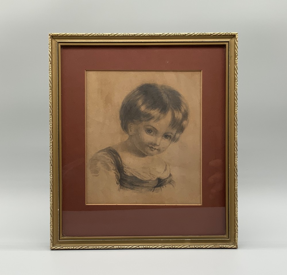 Pair of 19th-century pencil portrait drawings depicting children in gilded frames with reddish-brown mounts. View III