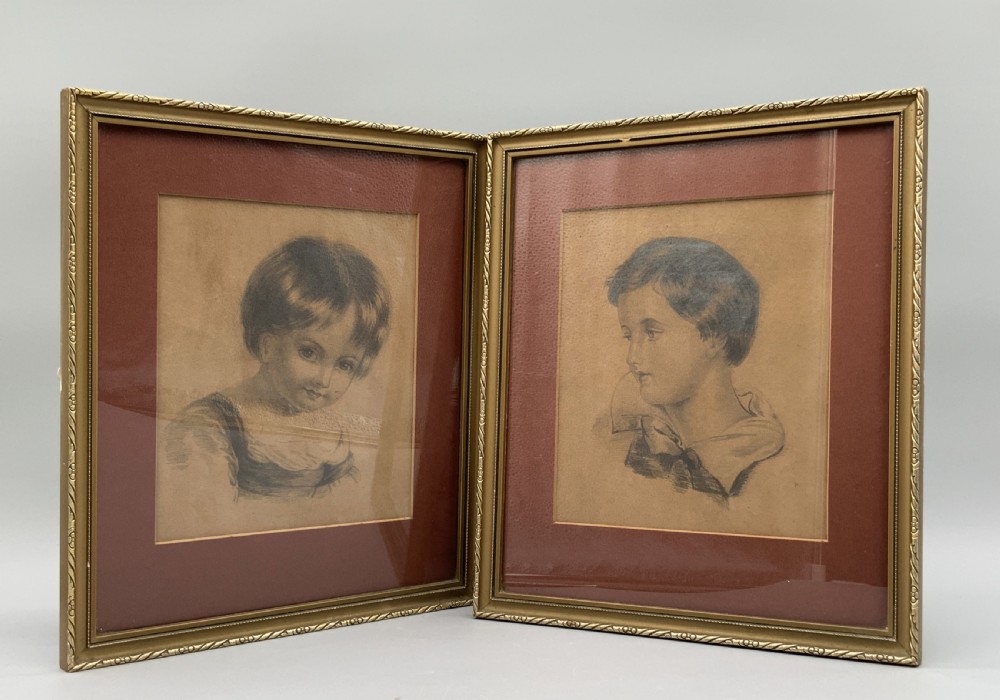 Pair of 19th-century pencil portrait drawings depicting children in gilded frames with reddish-brown mounts. View IV