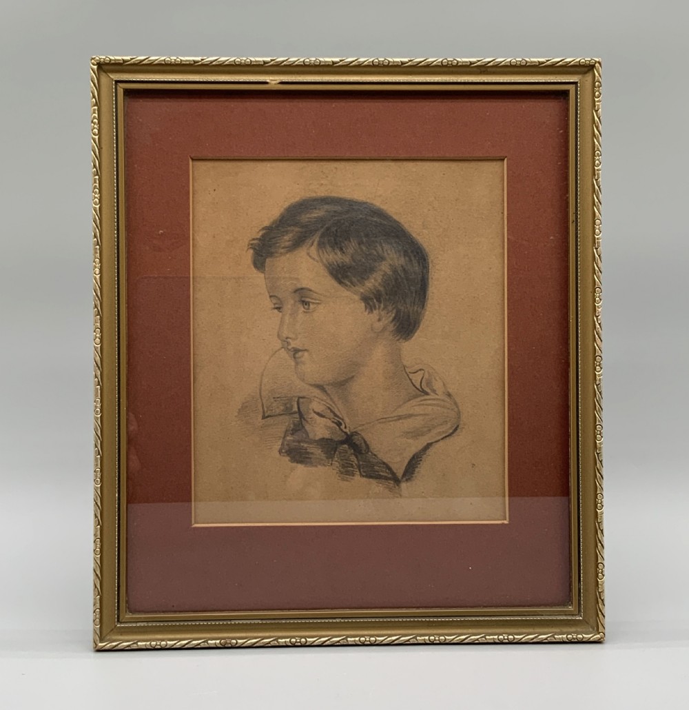 Pair of 19th-century pencil portrait drawings depicting children in gilded frames with reddish-brown mounts. View V