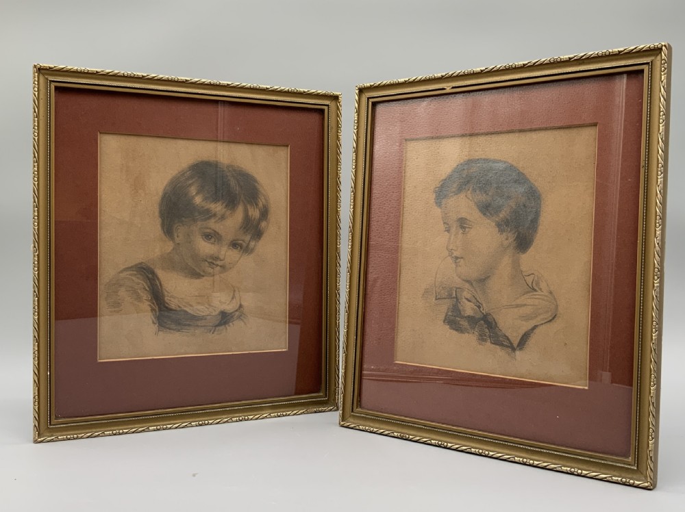 Pair of 19th-century pencil portrait drawings depicting children in gilded frames with reddish-brown mounts. View VIII