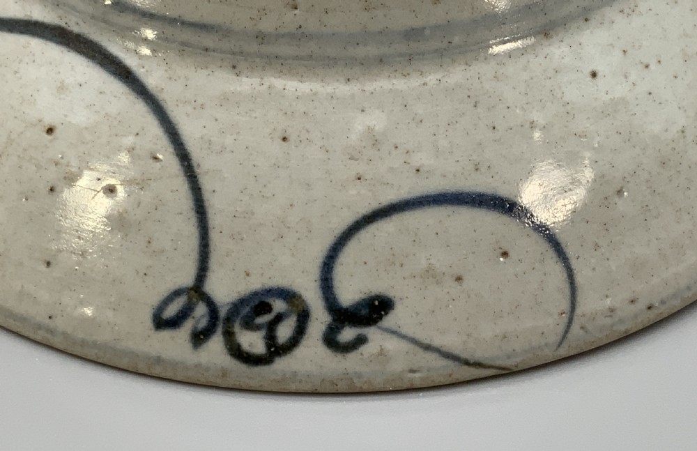 A 17th-century Chinese Swatow porcelain bowl featuring hand-painted underglaze blue geometric and floral motifs on an off-white glazed surface. View XIII
