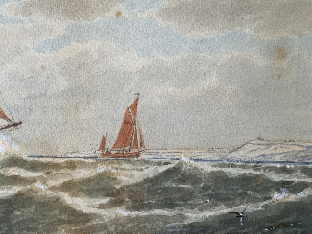A framed Victorian watercolour painting depicting sailing vessels on a choppy sea off Beachy Head, presented within a gold gilt frame and mount. View X