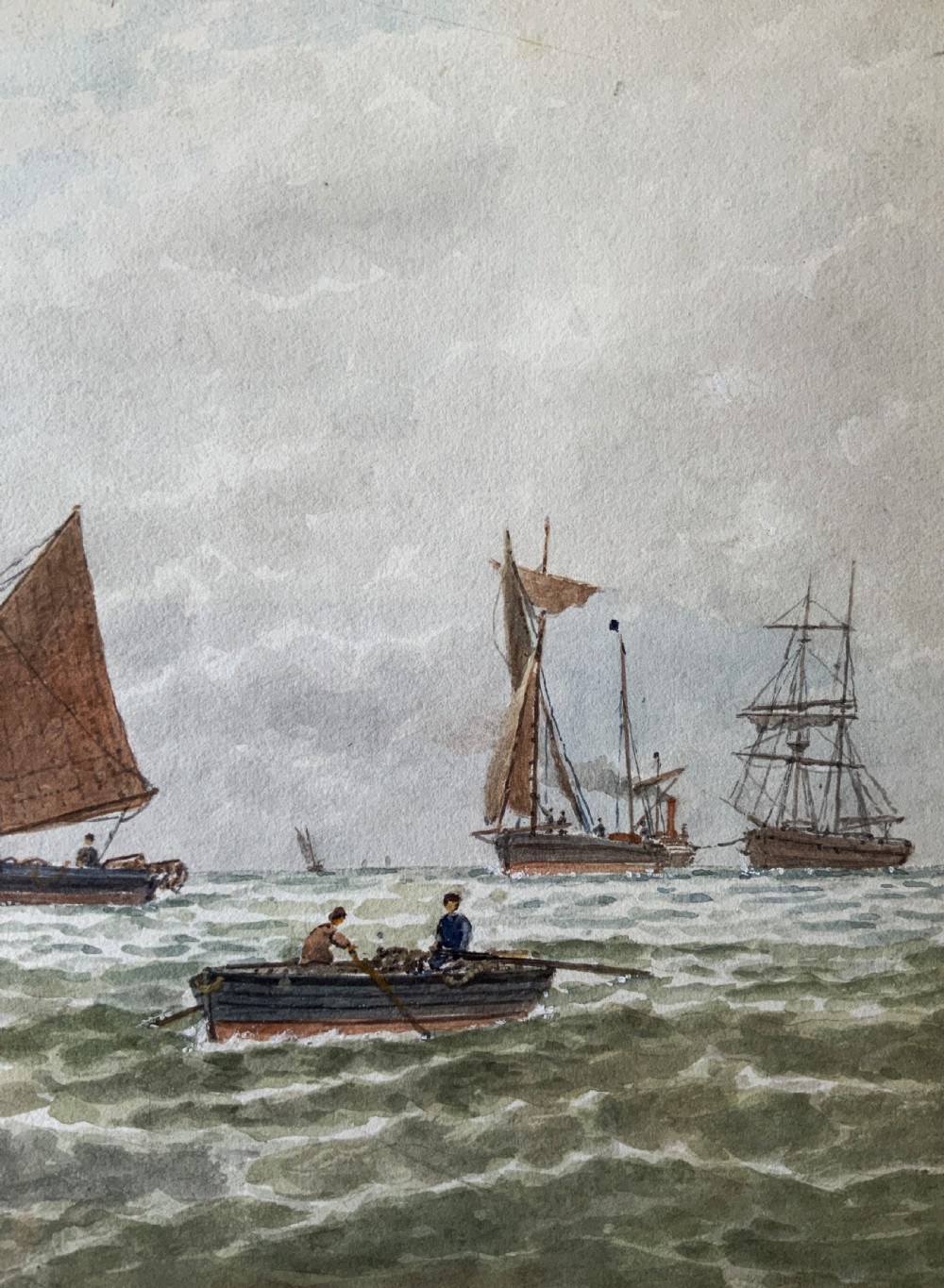 Framed Victorian watercolour painting featuring sailing barges with brown sails on choppy green waters under a cloudy sky. View V