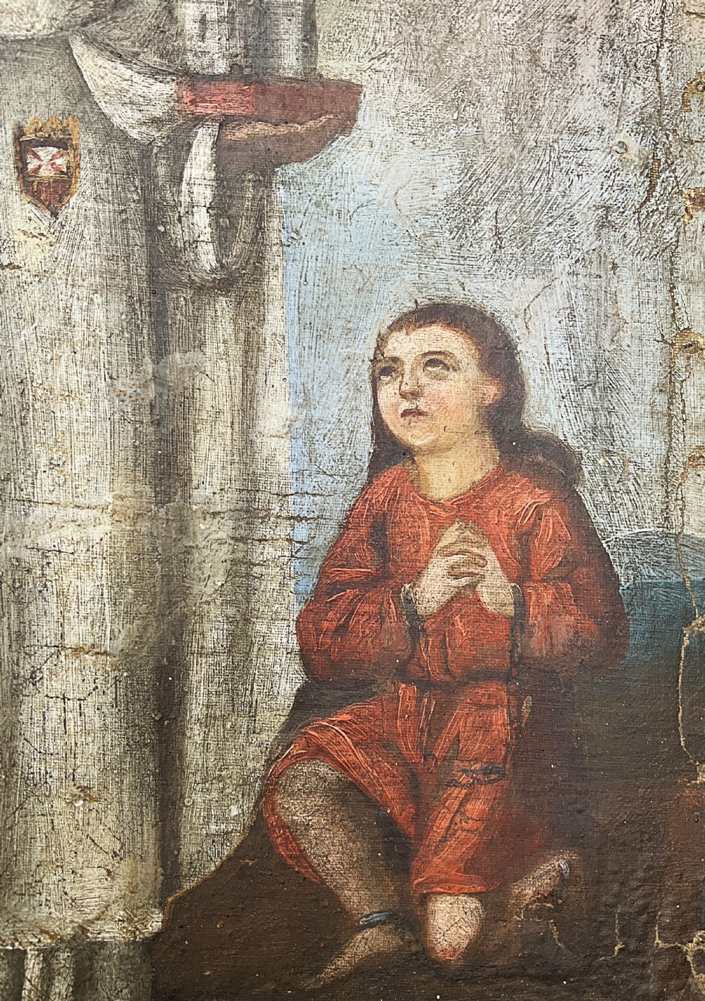 A 17th-century Spanish Baroque oil painting depicting a saint in a habit holding a banner alongside a kneeling figure, housed within an ornate carved giltwood lattice frame with mirrored glass inserts. View VIII
