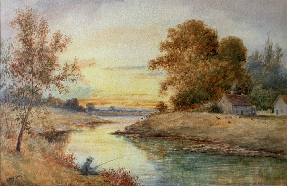 Framed antique watercolour painting depicting a figure fishing along a riverbank at sunset beside trees and cottages. View II