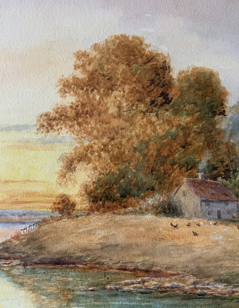 Framed antique watercolour painting depicting a figure fishing along a riverbank at sunset beside trees and cottages. View VIII