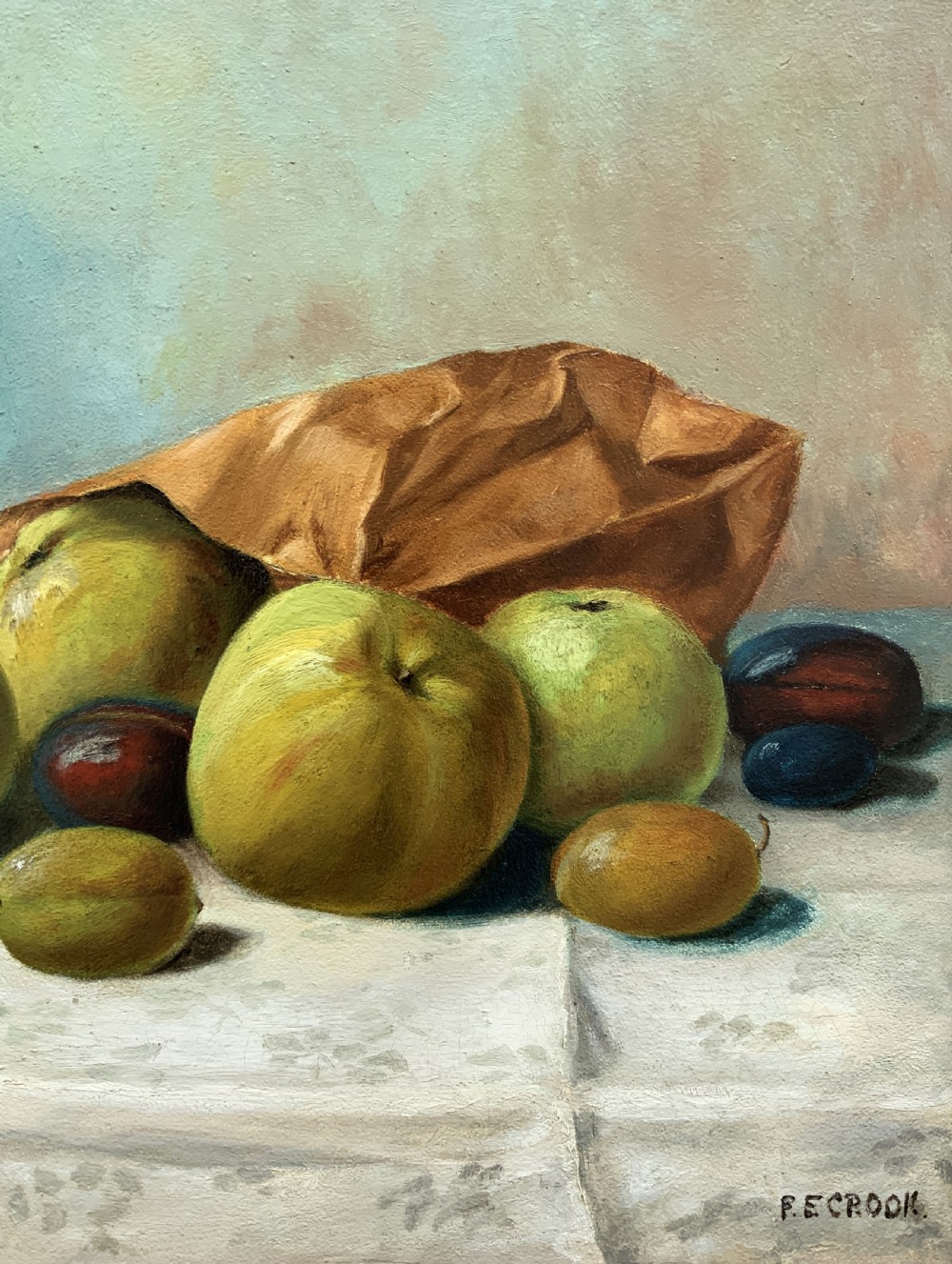 An Edwardian oil painting depicting a tabletop arrangement of apples, plums, and a green vase inside a broad gilt frame. View V