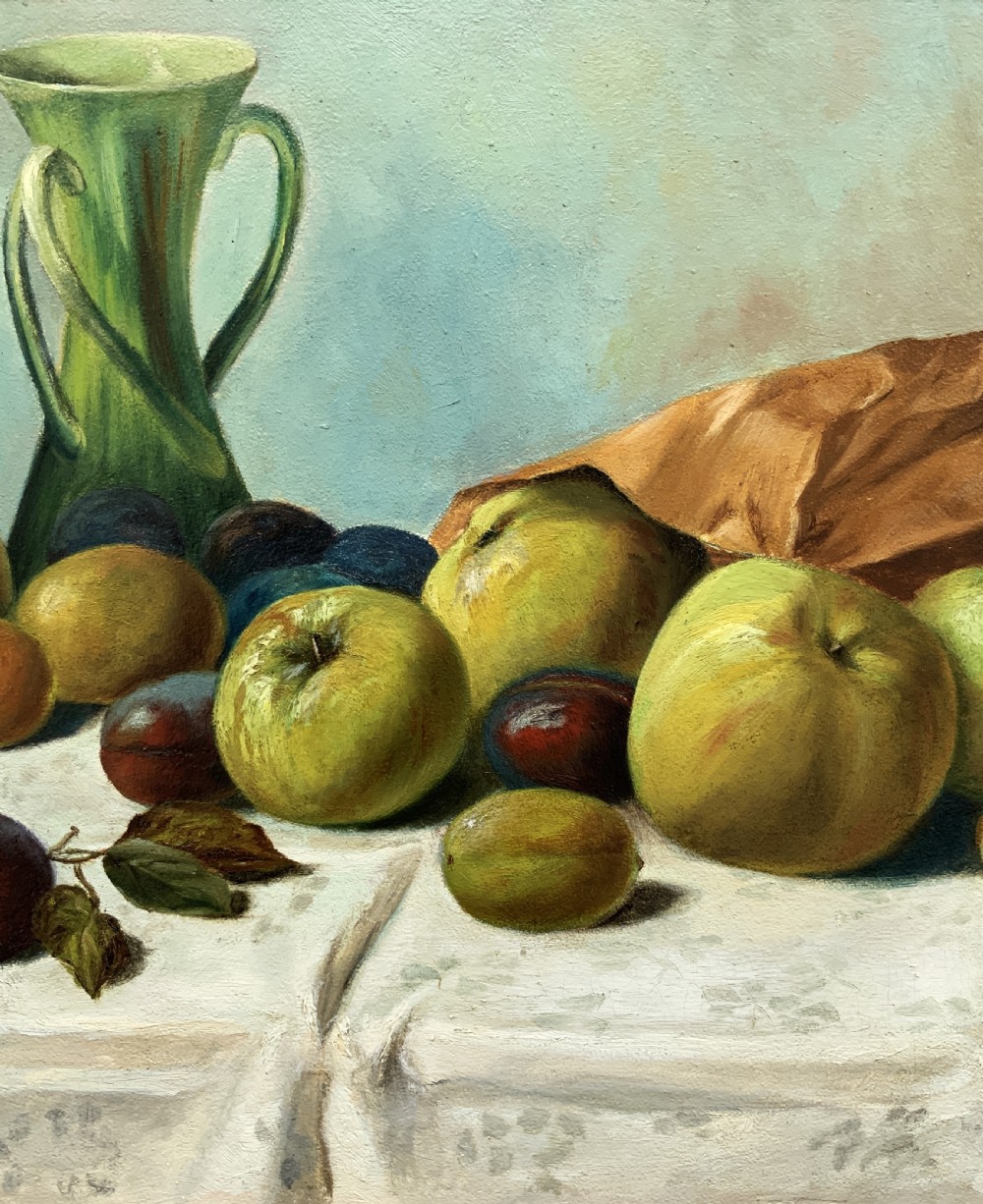 An Edwardian oil painting depicting a tabletop arrangement of apples, plums, and a green vase inside a broad gilt frame. View VI
