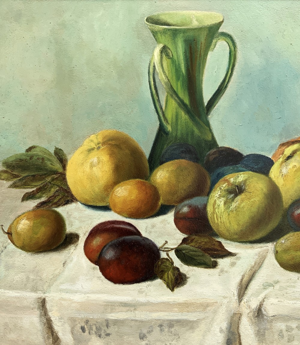 An Edwardian oil painting depicting a tabletop arrangement of apples, plums, and a green vase inside a broad gilt frame. View VII