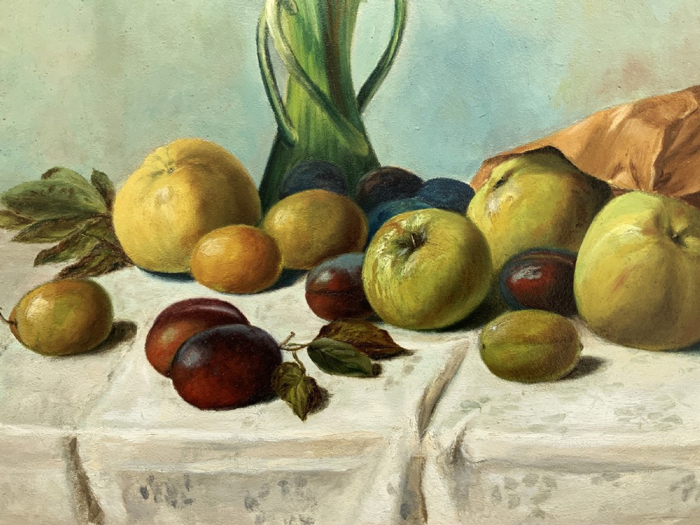 An Edwardian oil painting depicting a tabletop arrangement of apples, plums, and a green vase inside a broad gilt frame. View VIII