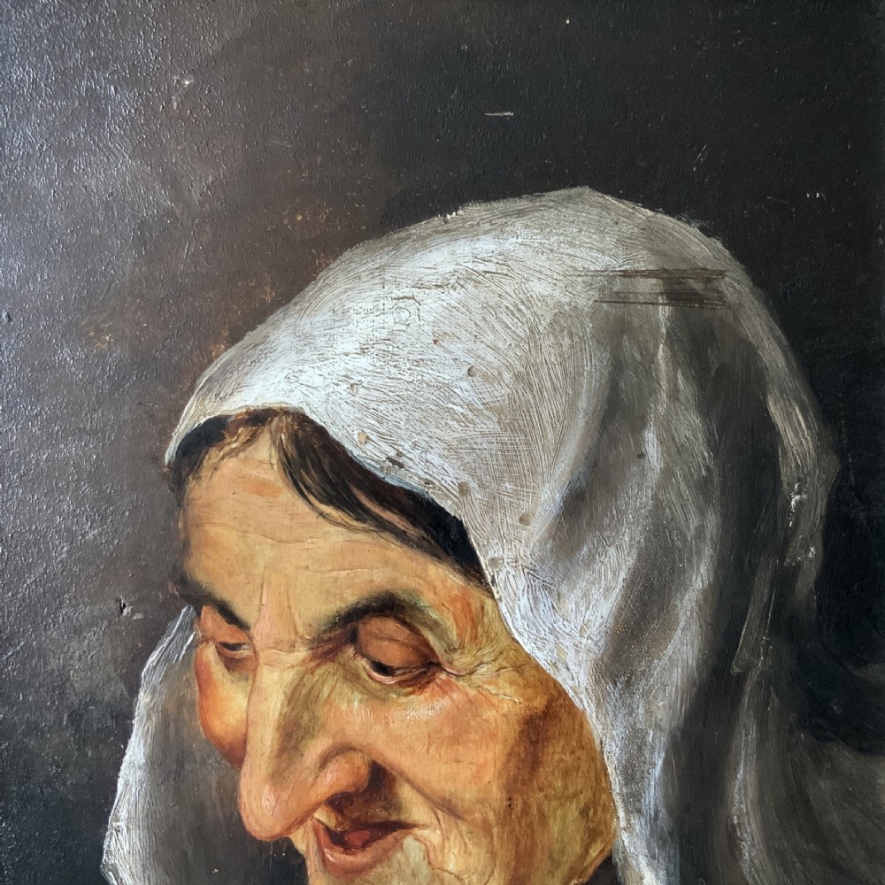 A 19th-century oil portrait painting depicting an elderly woman in a white headscarf looking downwards, set inside a silver-toned moulded frame. View VI