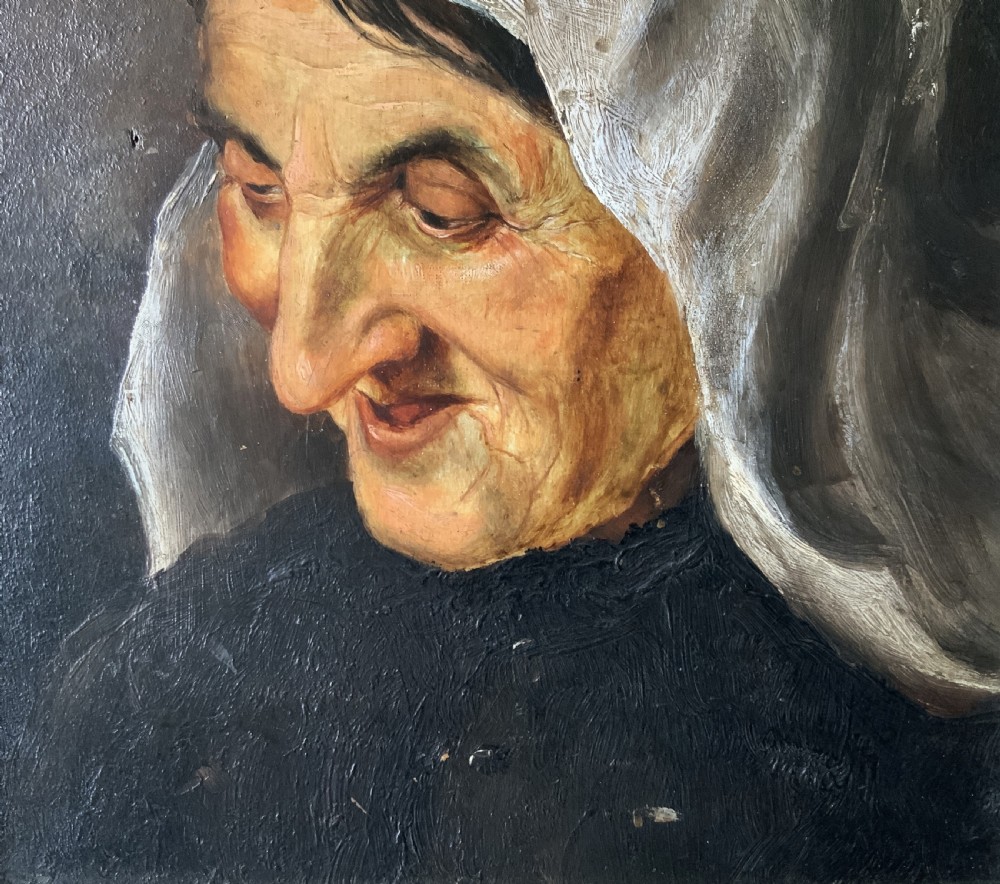 A 19th-century oil portrait painting depicting an elderly woman in a white headscarf looking downwards, set inside a silver-toned moulded frame. View VII